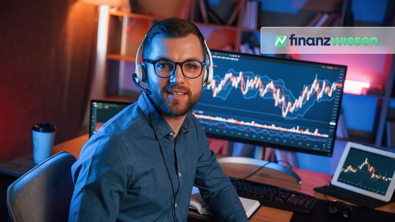 Trader am PC auf dem Charts zu sehen sind